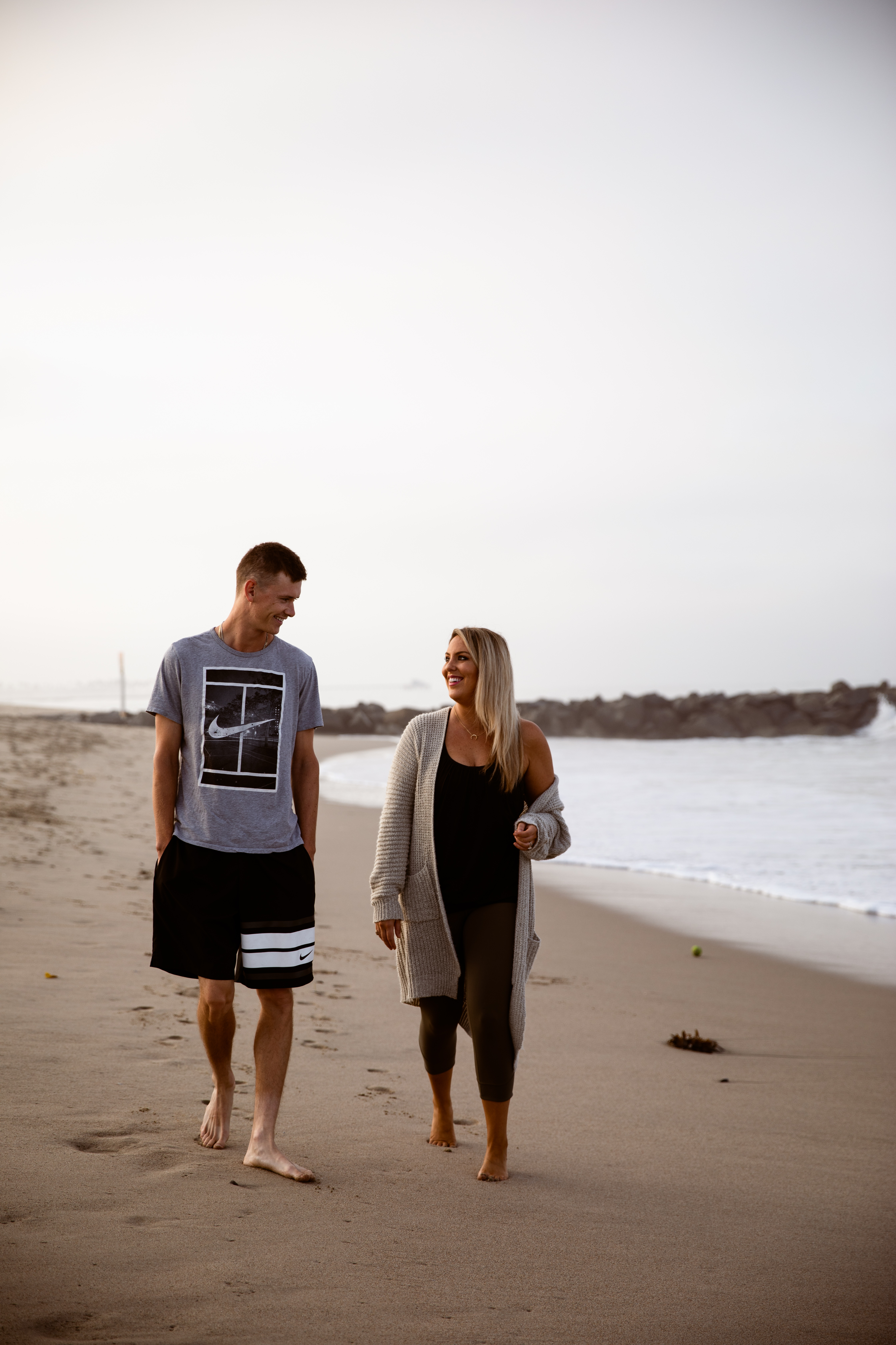 Newport Beach couple sunrise walking