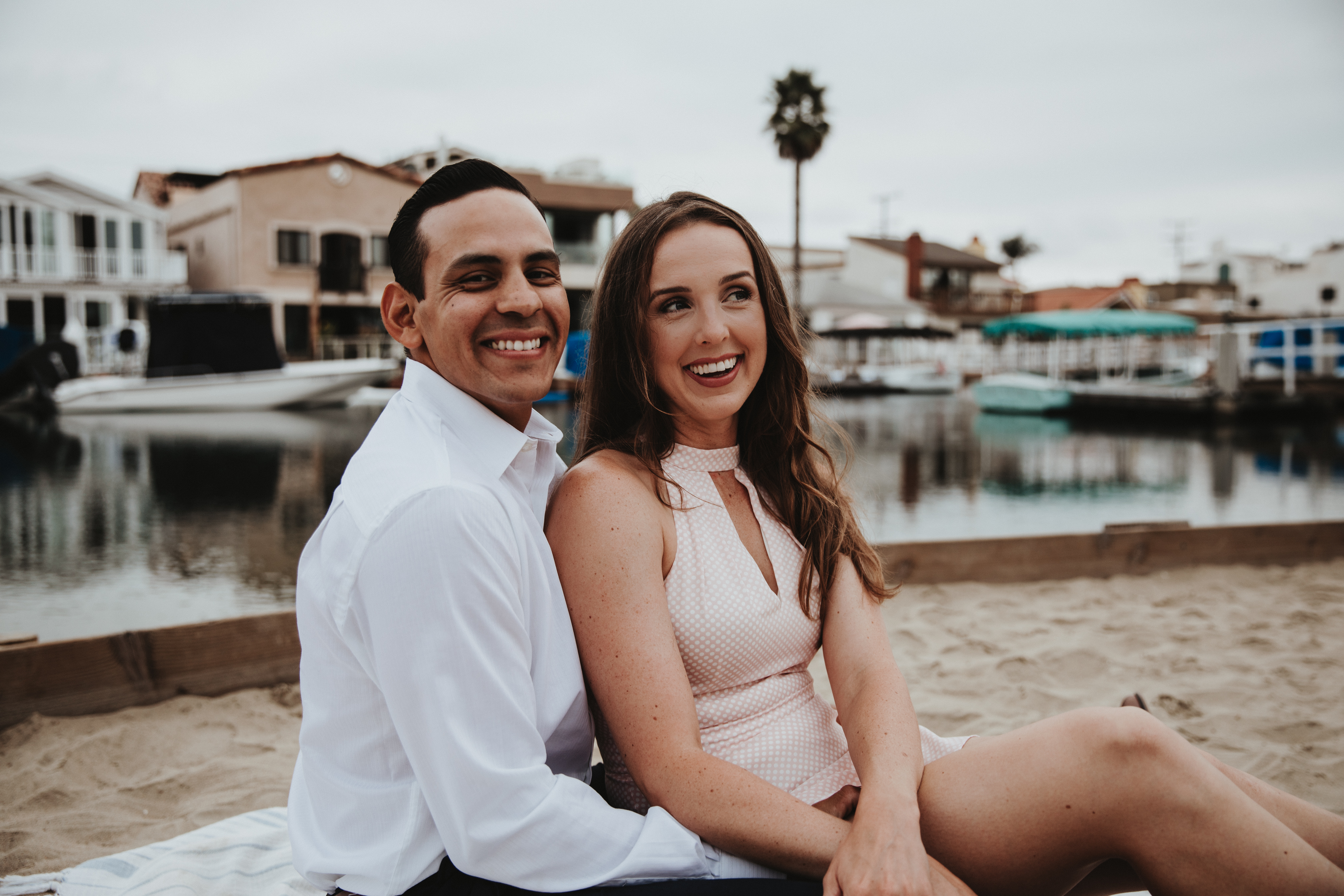Newport Beach couple engagement photography happy walking beach smiling love