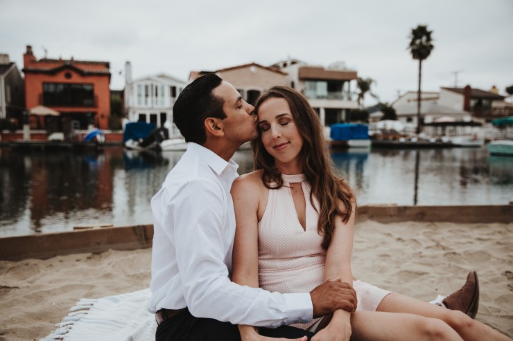 Newport Beach couple engagement photography happy walking beach smiling love