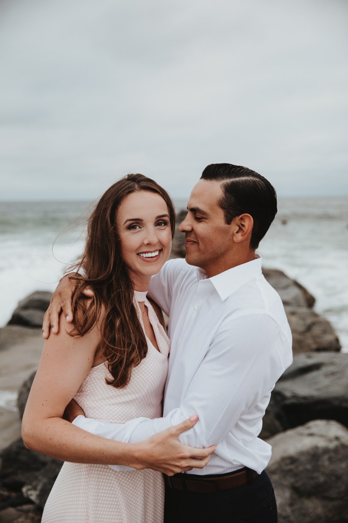 Newport Beach couple engagement photography happy walking beach smiling love